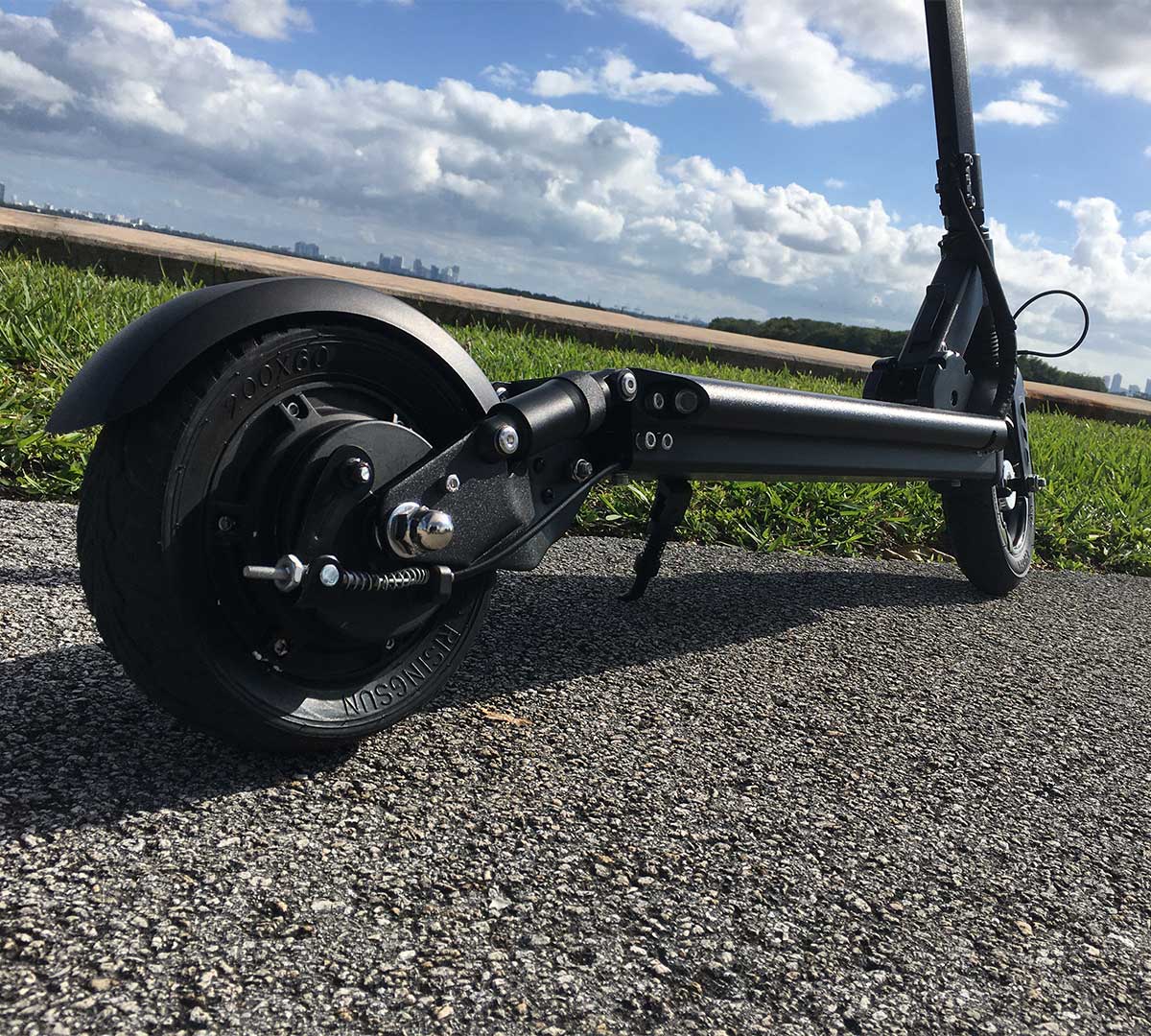 A close-up of the rear wheel of an electric scooter, emphasizing the importance of safety features for kids.